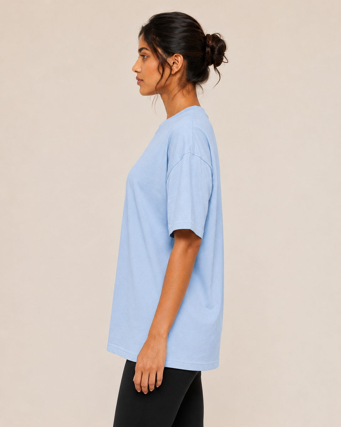 Unisex oversized terry cloth t-shirt in neutral color, casual fit, made by myattractivethings, shown on a hanger.