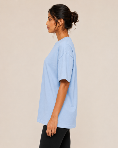 Unisex oversized terry cloth t-shirt in neutral color, casual fit, made by myattractivethings, shown on a hanger.