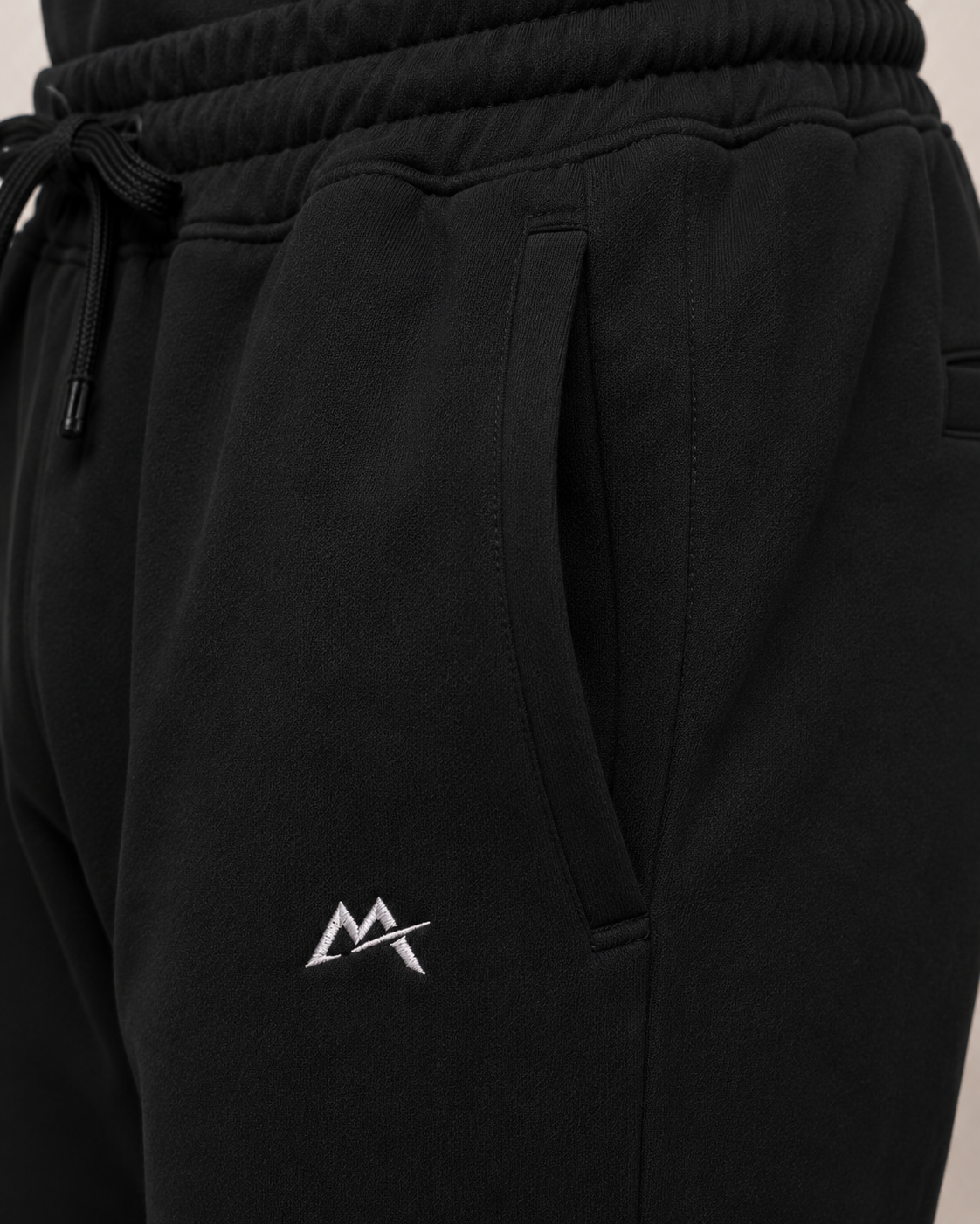 Unisex joggers by myattractivethings featuring a relaxed fit, soft fabric, and stylish design, shown on a model.