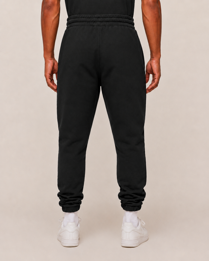Unisex black joggers from myattractivethings, made of soft fabric with an elastic waistband and tapered fit for casual wear.